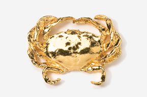 A gold crab is sitting on top of the table.