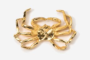 A gold crab is sitting on top of the table.