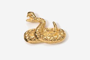 A gold snake is sitting on top of the ground.