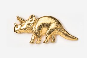 A gold plated triceratops dinosaur pin.