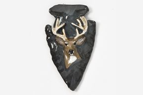 A deer head on an arrowhead with black background