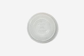 A white plastic lid with a picture of a person on it.