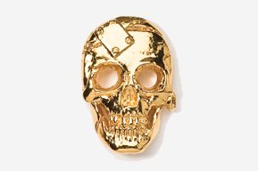 A gold skull with a clock on it's face.