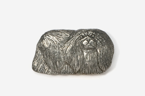 A silver object of a dog with long hair.