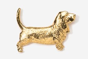 A gold dog is standing up and looking at the ground.