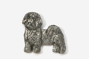 A silver dog is standing up against the wall.