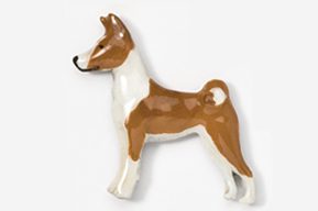 A brown and white dog is standing up