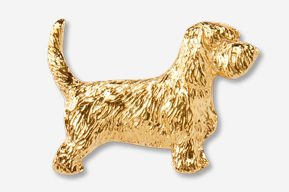 A gold plated dog is standing up to the side.