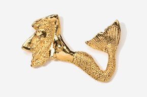 A gold colored fish shaped pin with a tail.