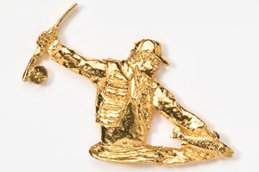 A gold statue of a man on skis.