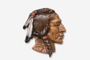 A picture of an indian head ornament.