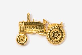 A gold tractor is shown in this picture.