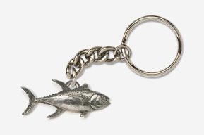 A silver keychain with a fish on it.