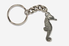 A silver key chain with a seahorse charm.