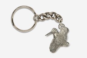 A silver key chain with a bird on it.