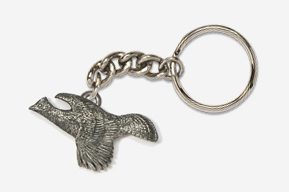 A silver key chain with an eagle on it.