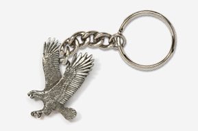 A silver key chain with an eagle on it.