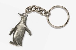 A silver penguin keychain with chain attached.