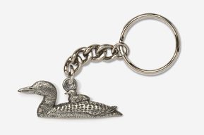 A silver key chain with an alligator on it.