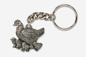 A silver key chain with a chicken and chicks.