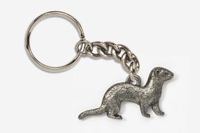 A metal key chain with an animal on it.