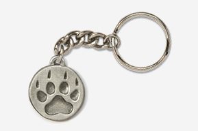 A silver key chain with a paw print on it.