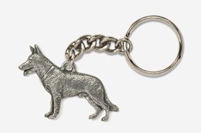 A silver key chain with a dog on it.