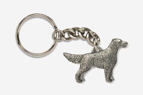 A silver key chain with a dog on it.