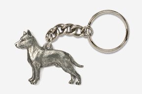 A silver key chain with a dog on it.