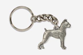 A silver key chain with a dog on it.