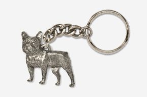 A silver key chain with a dog on it