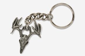 A silver key chain with a deer skull on it.