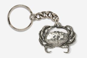 A silver crab keychain with chain attached.