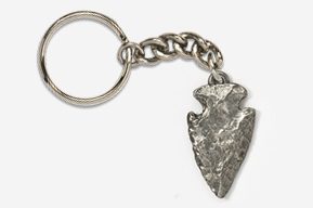 A silver arrowhead keychain with a chain.