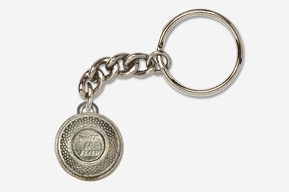 A silver key chain with a coin on it.