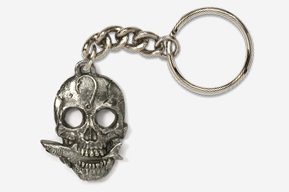 A silver skull keychain with a chain around it.