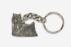 A silver key chain with a dog on it.