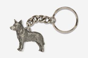 A silver key chain with a dog on it.