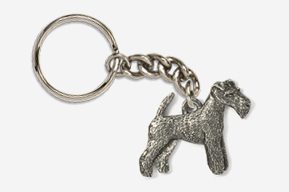 A silver key chain with a dog on it.