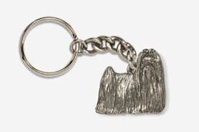 A silver key chain with a picture of a dog.