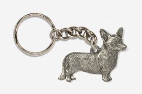 A silver key chain with a dog on it.