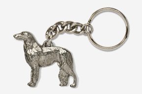 A silver key chain with a dog on it