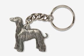 A silver key chain with a dog on it