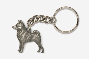 A silver key chain with a dog on it.