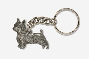 A silver key chain with a dog on it.