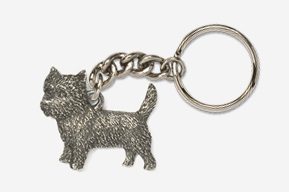 A silver key chain with a dog on it.