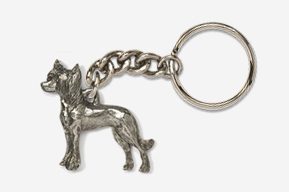 A silver key chain with a dog on it