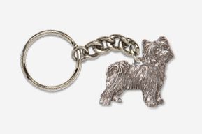 A silver key chain with a dog on it