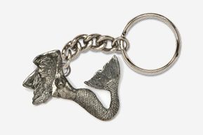 A silver key chain with a mermaid on it.