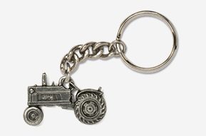 A silver tractor keychain with a chain attached.